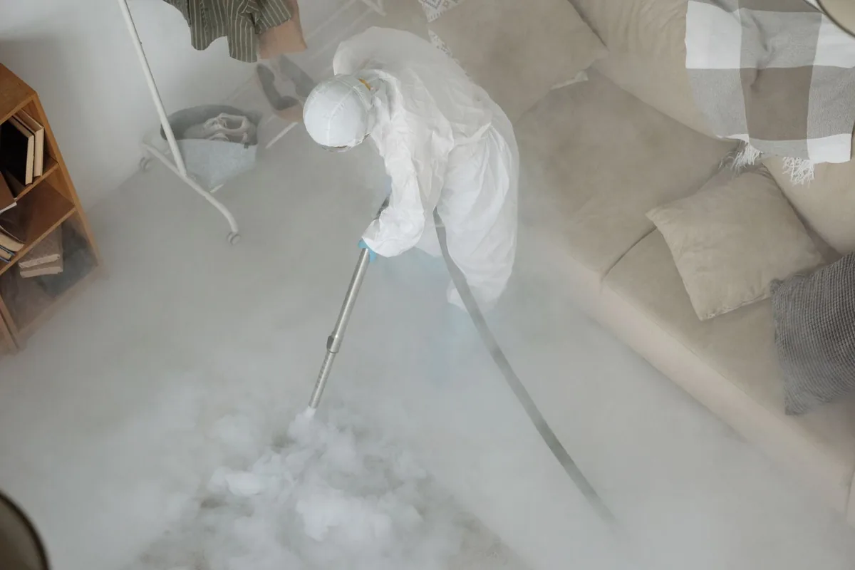 Biohazard cleanup technician in protective equipment, Bridgetown, MS